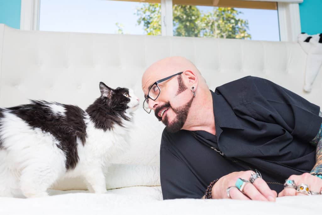 Jackson Galaxy with a black and white cat