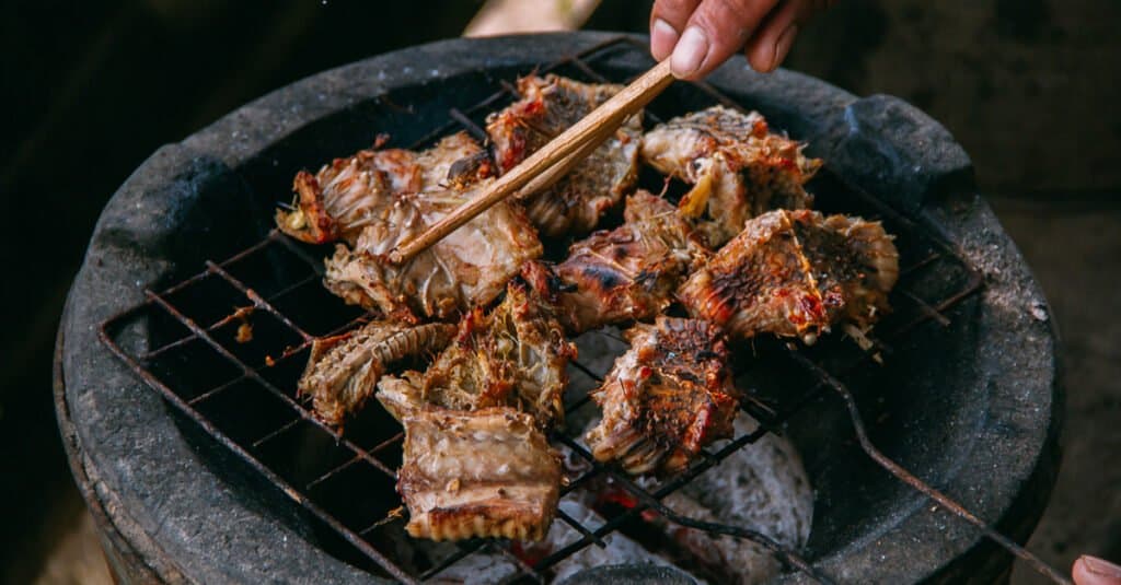 snake meat on grill by local