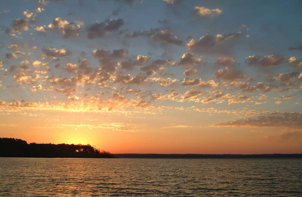 A photo of a lake during sunset. 