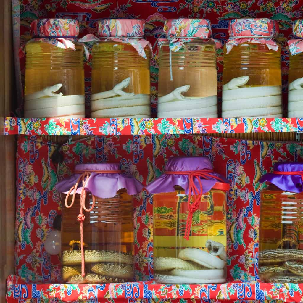 Jars filled with habu snakes in awamori, a liquor similar to sake on a shop's shelves