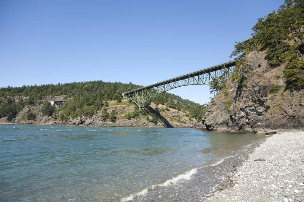 View of the Deception Pass Bridge from the beach below.  Deception Pass is located at the north end of Whidbey Island in the state of Washington.