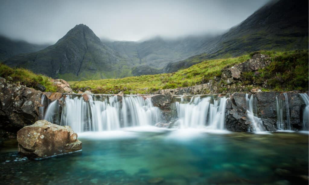 Panoramic view of the captivating Isle of Skye in Scotland, showcasing its rugged landscapes, rolling hills, and enchanting beauty