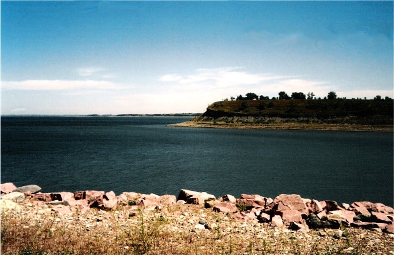 A photo of a sun-drenched Lake Sakakawea in North Dakota, the largest man-made lake in the state.