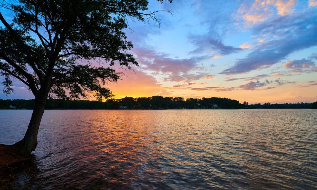  Suns rays reflecting off of the glassy surface of Lake Keowee in South Carolina.