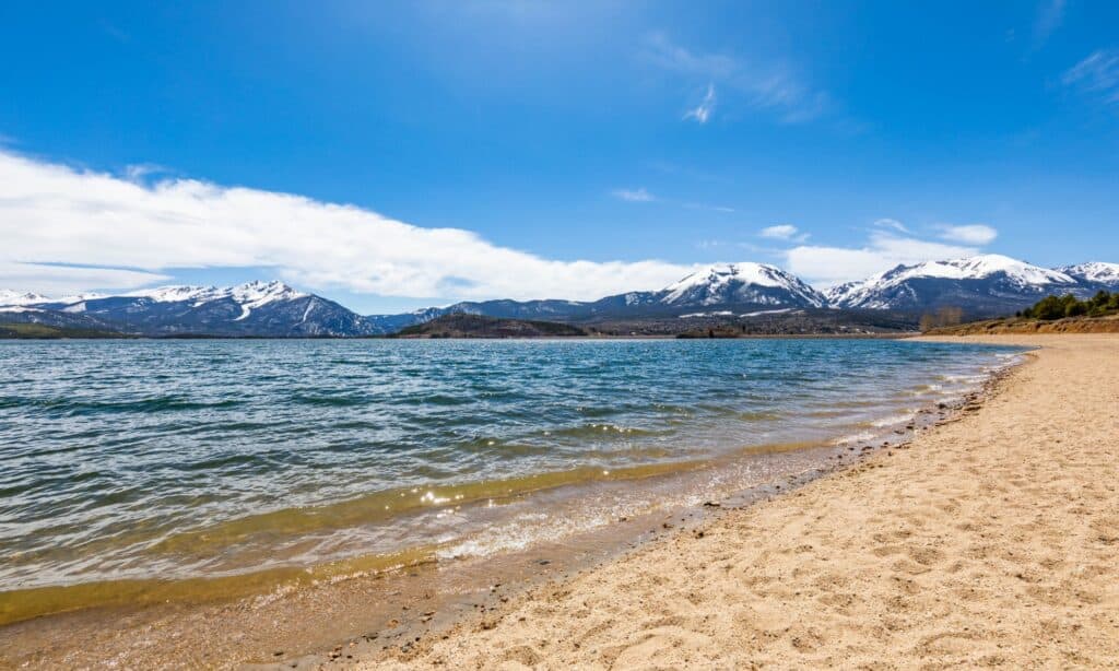 A jaw dropping landscape photo of Dillon Lake with mountains in the back. 