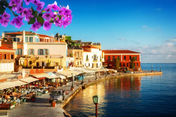 bay of Chania at sunny summer day, Crete Greece with flowers