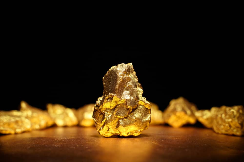Closeup of big gold nugget finance concept