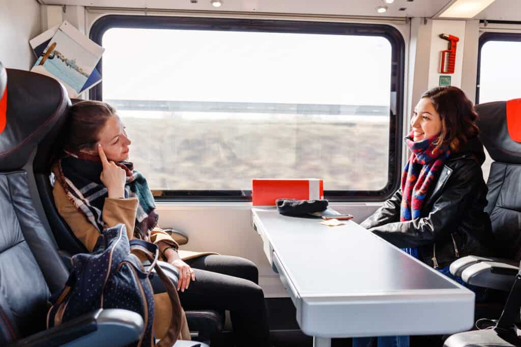 two women talking on the train