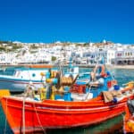Traditional fishing boats moored in the old port of Mykonos island in Greece.