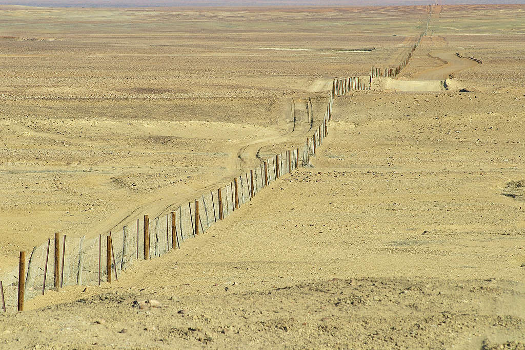 Dingoe fence in the Australian Outback. The fence is 9600 kilometers long, it keeps the dingoe dogs out of the areas, where the sheep graze.