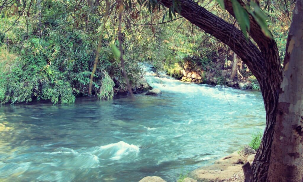 A view of the Jordan River with turquoise water