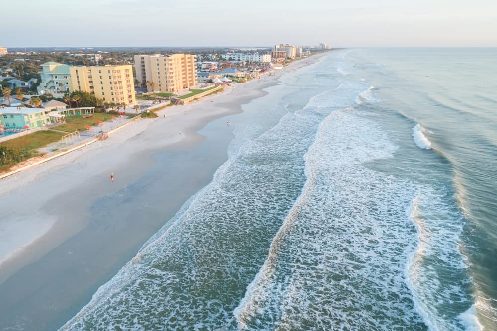 Aerial vies of waves  crashing onto New Smyrna Beach, Florida.