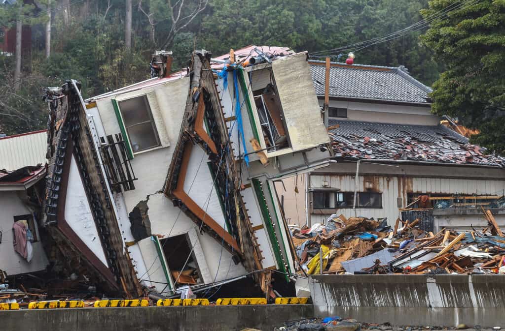 A home flipped on its side due to the The 2011 Tohoku Earthquake and Tsunami