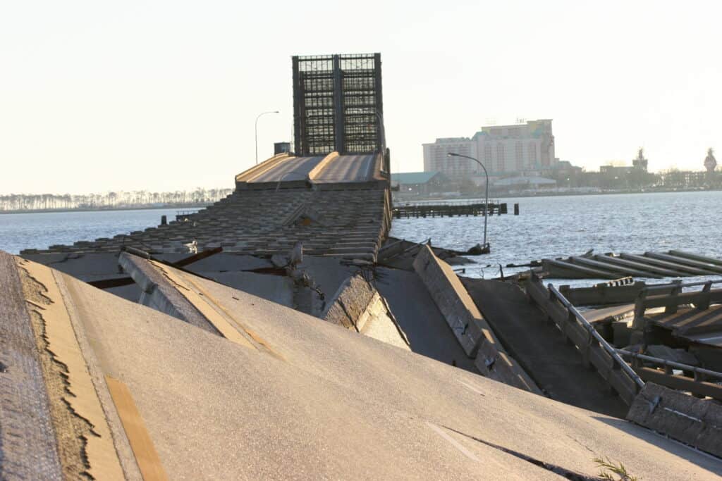 Floodwaters destroy a bridge in Biloxi, MS