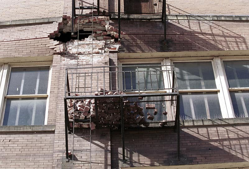 Photo of bricks from crumbling wall captured by fire escapes after the 2001 Washington earthquake