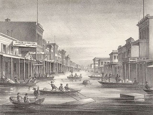 A lithograph of citizens rowing boats through the streets of Sacramento, CA, during the great flood of 1862.