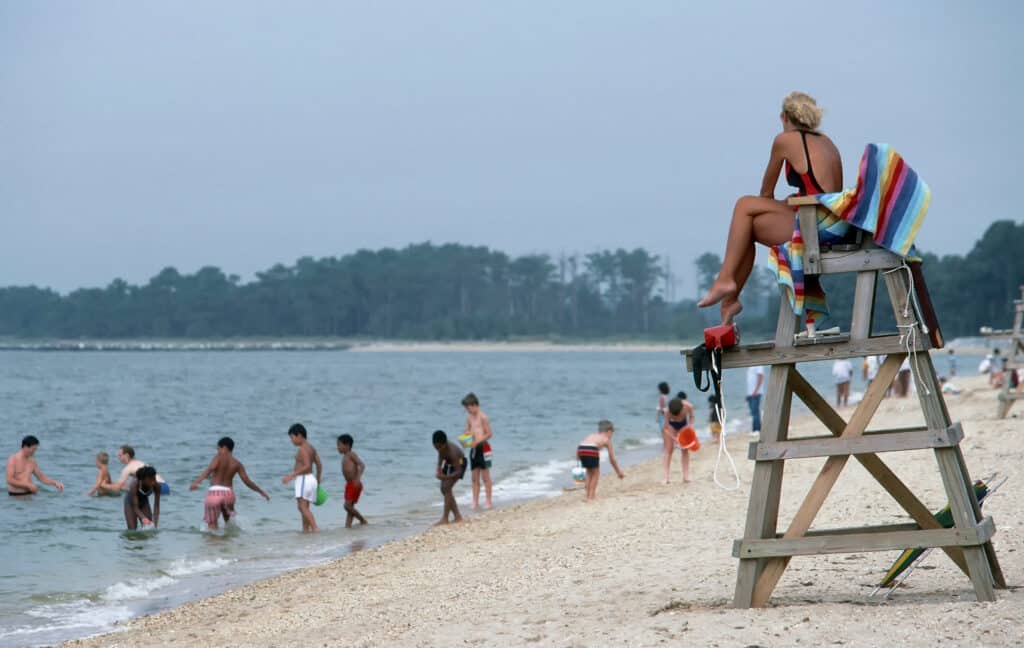 Children playing on a beach, enjoying the summer sun and sand. 