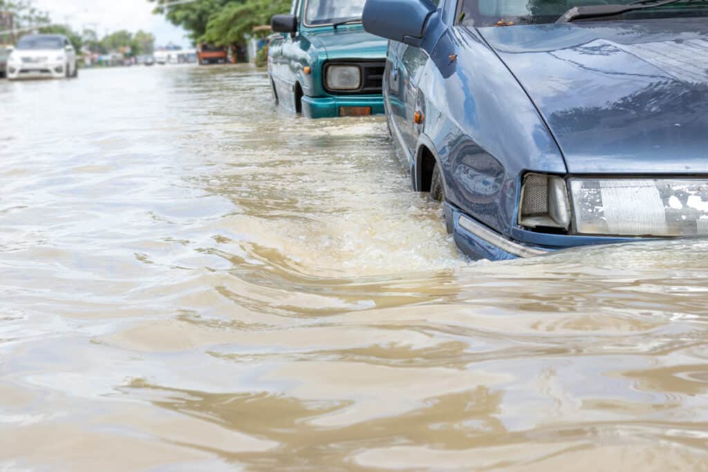 Cars stuck on flooded road