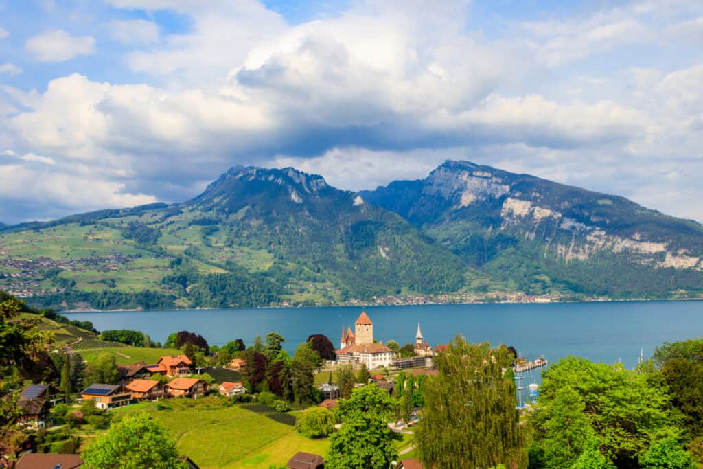 Aerial view of Spiez town with Spiez castle and Lake Thun in the Bernese Oberland, Switzerland