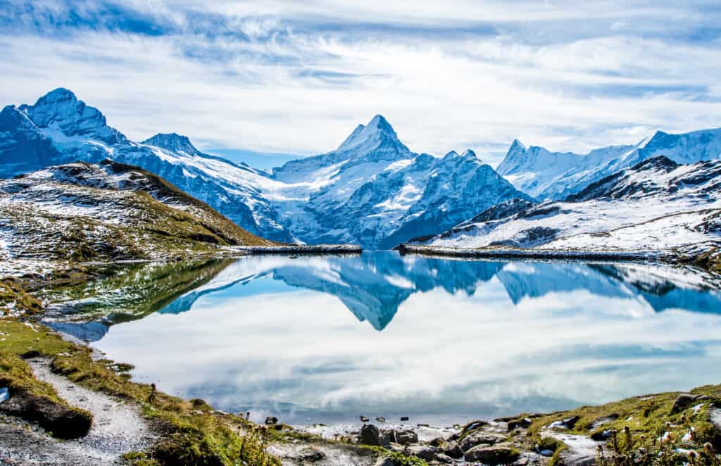 View of the Swiss Alps reflected in a mountain lake (Bachalpsee)