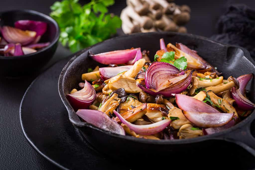 Beech mushrooms and vegetables fried in a skillet