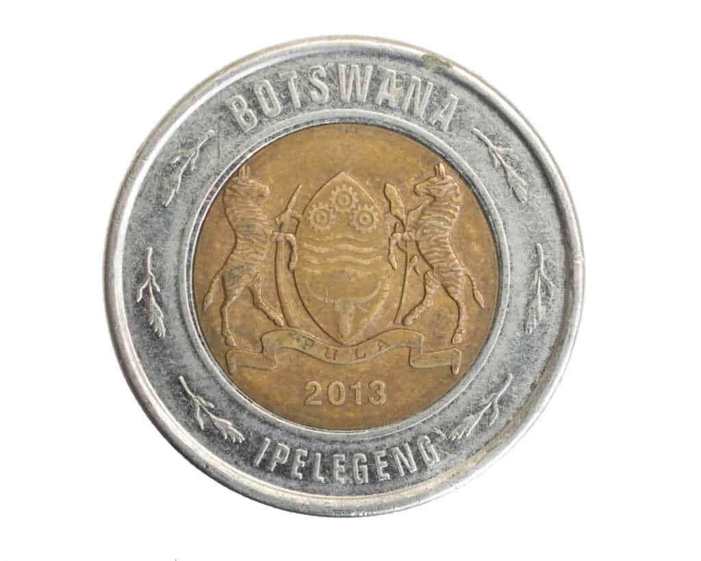 Two Botswana coin pot on white isolated background
