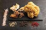 cauliflower mushroom on cutting board with spices