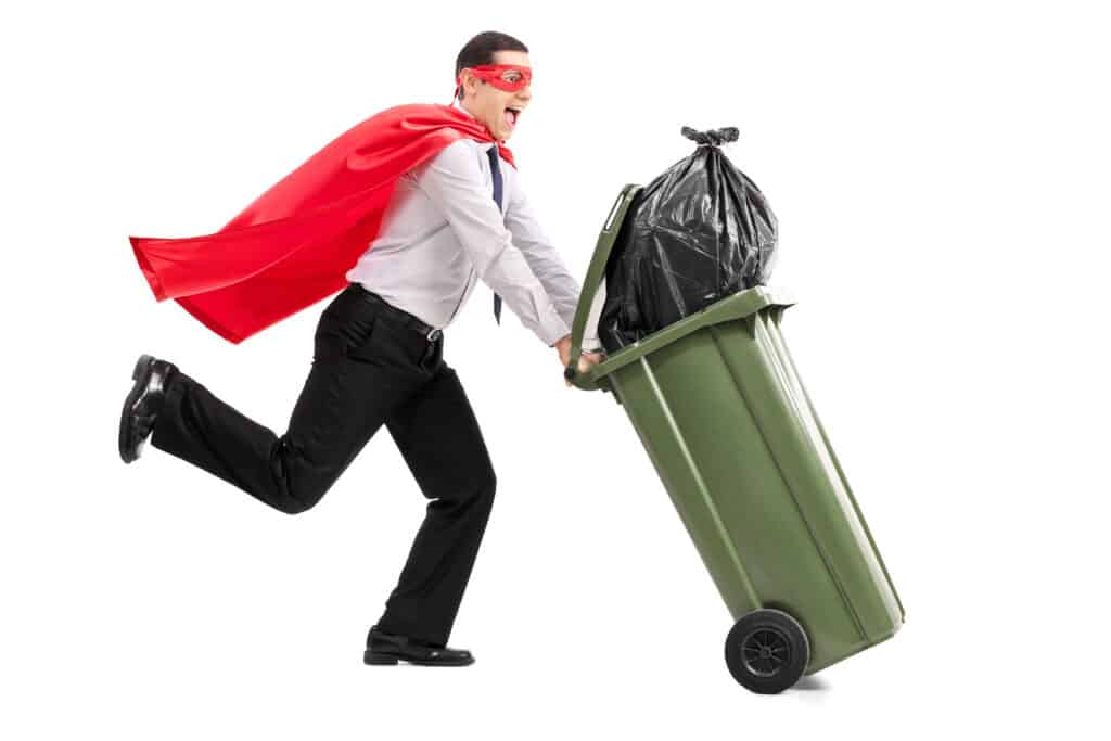Man pushing a trash can