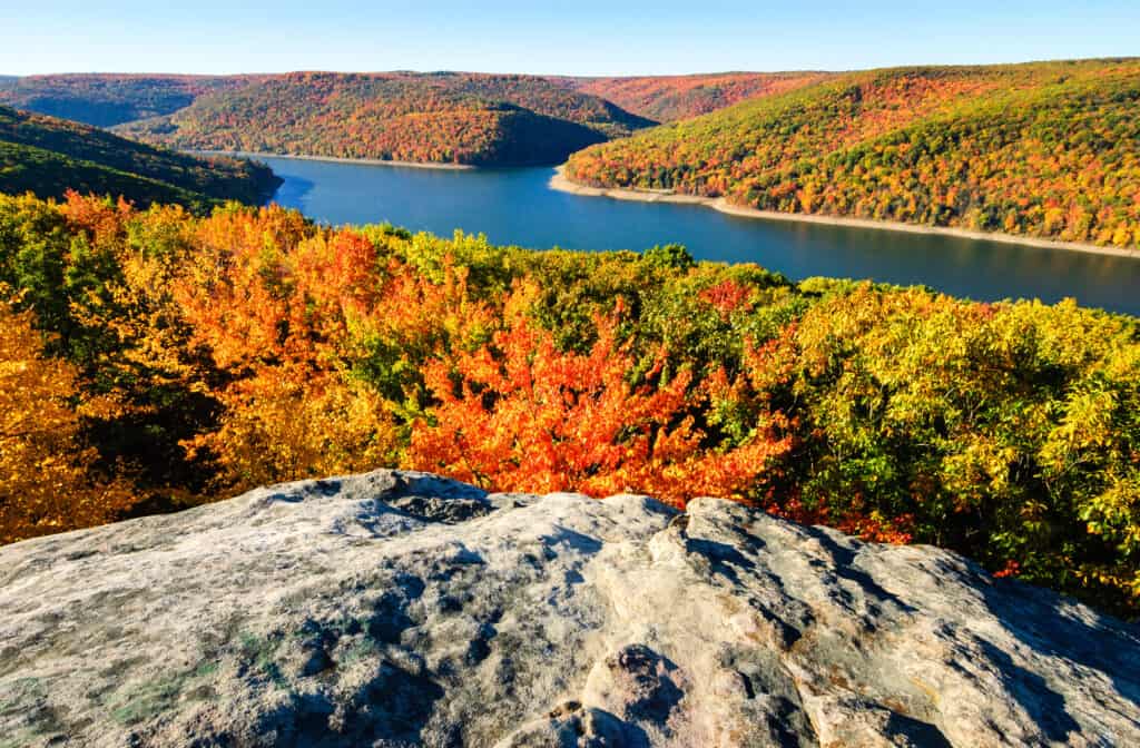 Dramatic rocky overlook in the Allegheny National Forest with brilliant fall foliage