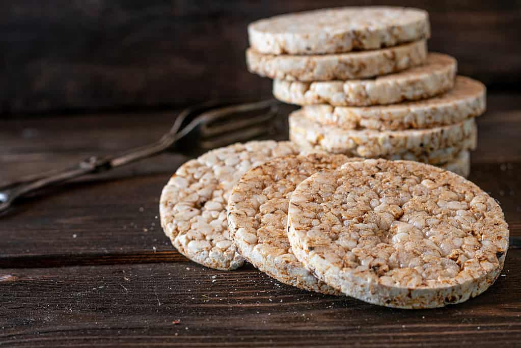 Puffed rice cakes on wooden background