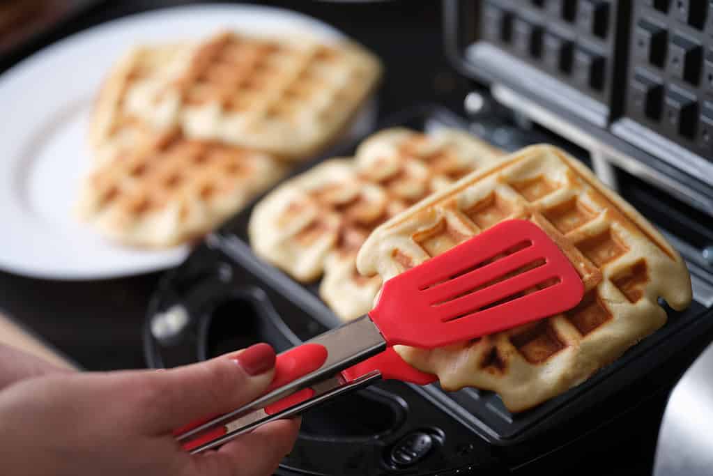 Waffles being made on a waffle iron