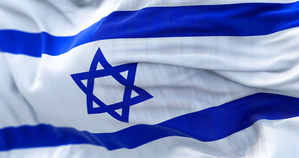 Close-up view of the Israel national flag waving in the wind.