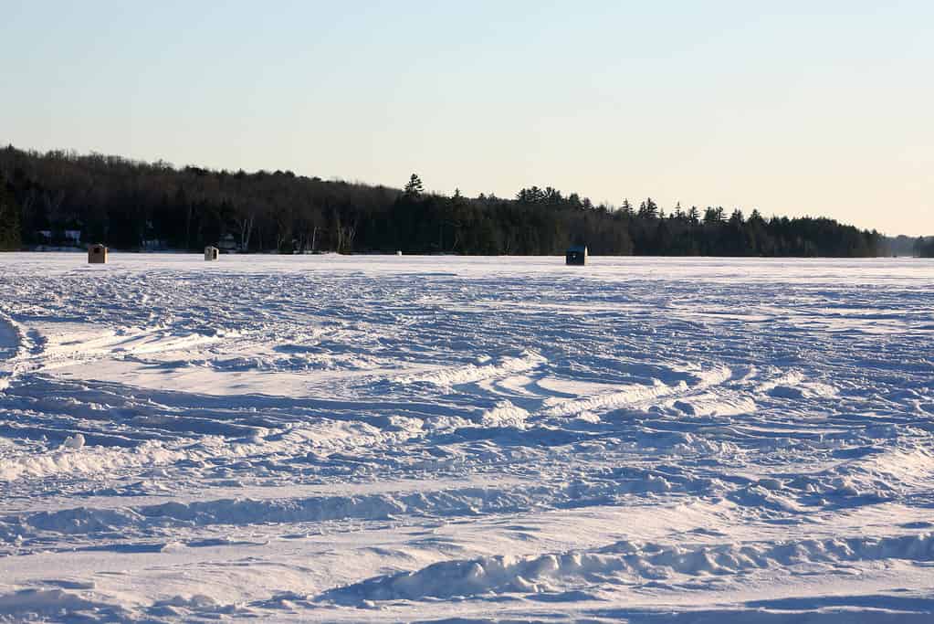 Ice fishing shacks on a lake in Maine