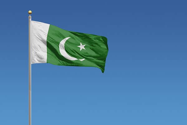 Flag of Pakistan in front of a clear blue sky