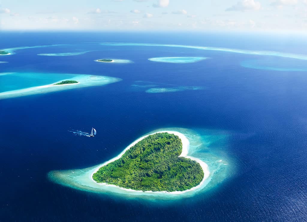Aerial view of a heart shaped island in the Maldives