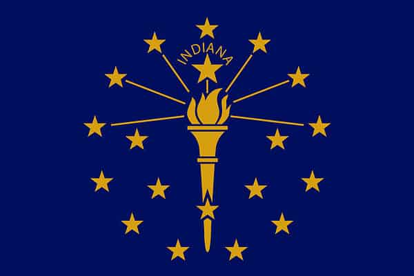 Indiana's flag is a blue field with a torch surrounded by 19 stars - 13 in an outer circle, an inner semi-circle of five stars, and a large star above the torch, with 
