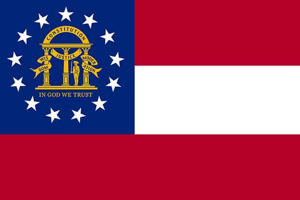 Georgia's flag has three horizontal stripes, including a red-white-red triband and a blue canton by the side. The blue canton has a circle of 13 white stars at its center, with the gold-colored state Coat of Arms within the white stars. 