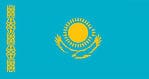 The flag of Kazakhstan consists of a sky blue field with the sun’s image taking up the center position and a steppe eagle soaring beneath it. There’s also a vertical band along the flagstaff, which features the national ornamental patterns.