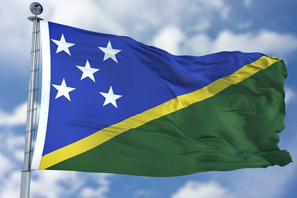 Solomon Islands Flag in a Blue Sky. Use this clip loud and proud to express loyalty and love to our country. It is a seamless loop with luma channel.