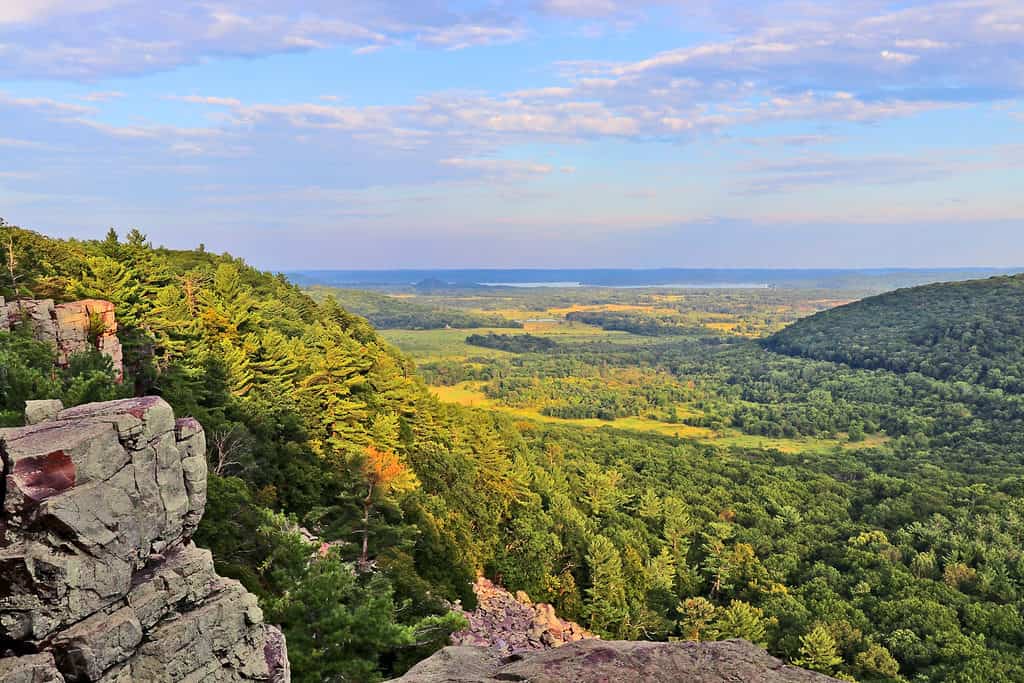 Beautiful Wisconsin summer nature background. Areal view from rocky ice age hiking trail during sunset hours. Devil's Lake State Park, Baraboo area, Wisconsin, Midwest USA.