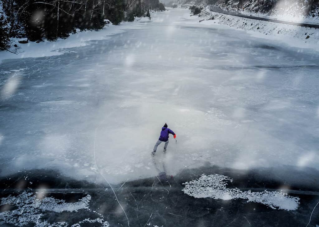 Beautiful aerial shot of an ice skater on Lake placid