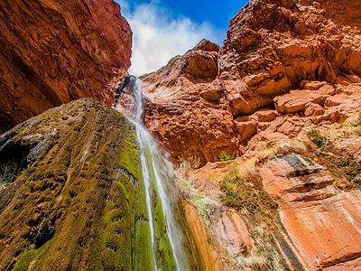 A Watch as Heavy Rain Creates Waterfalls Falling Throughout the Grand Canyon