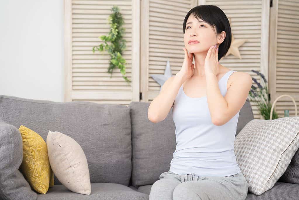Woman Massaging Parotid Gland - Largest Salivary Gland