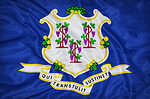 The flag of Connecticut features a dark blue background.