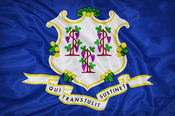 The flag of Connecticut features a dark blue background.