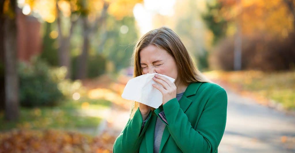 sneezing woman