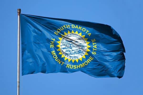 The flag of South Dakota features the state nickname, the Mount Rushmore State.