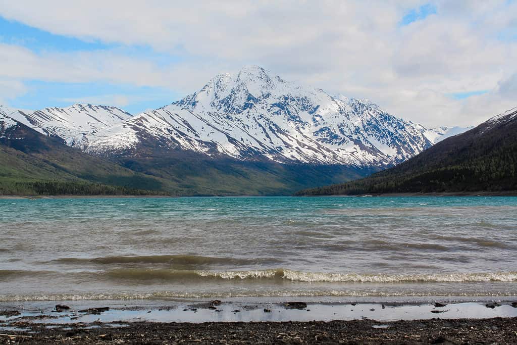 Eklutna Lake in Alaska surrounded by white capped mountains