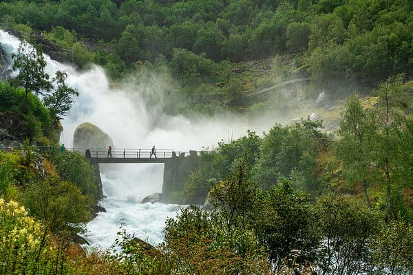 Bridge in waterfall, green landscape Norway. Jostedalsbreen national park