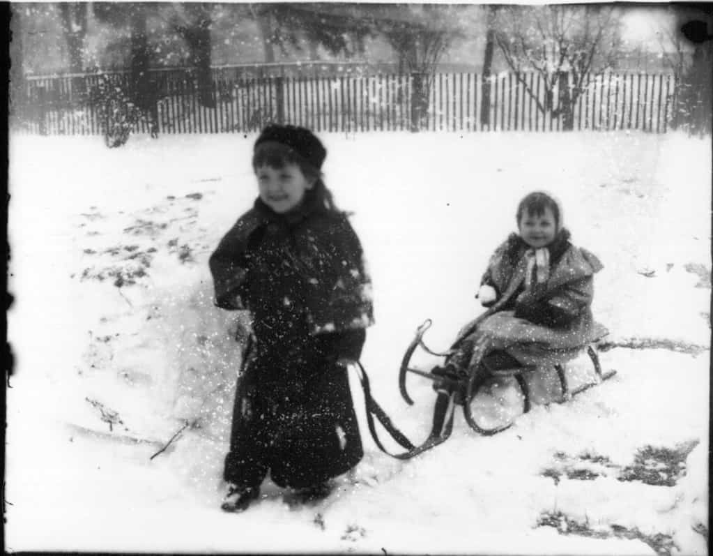 Children playing with sleigh in the snow 1903 in Oxford, Ohio